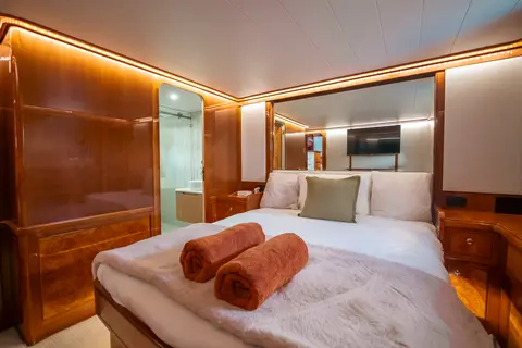 The master suite bed with ensuite view on Bote Charters